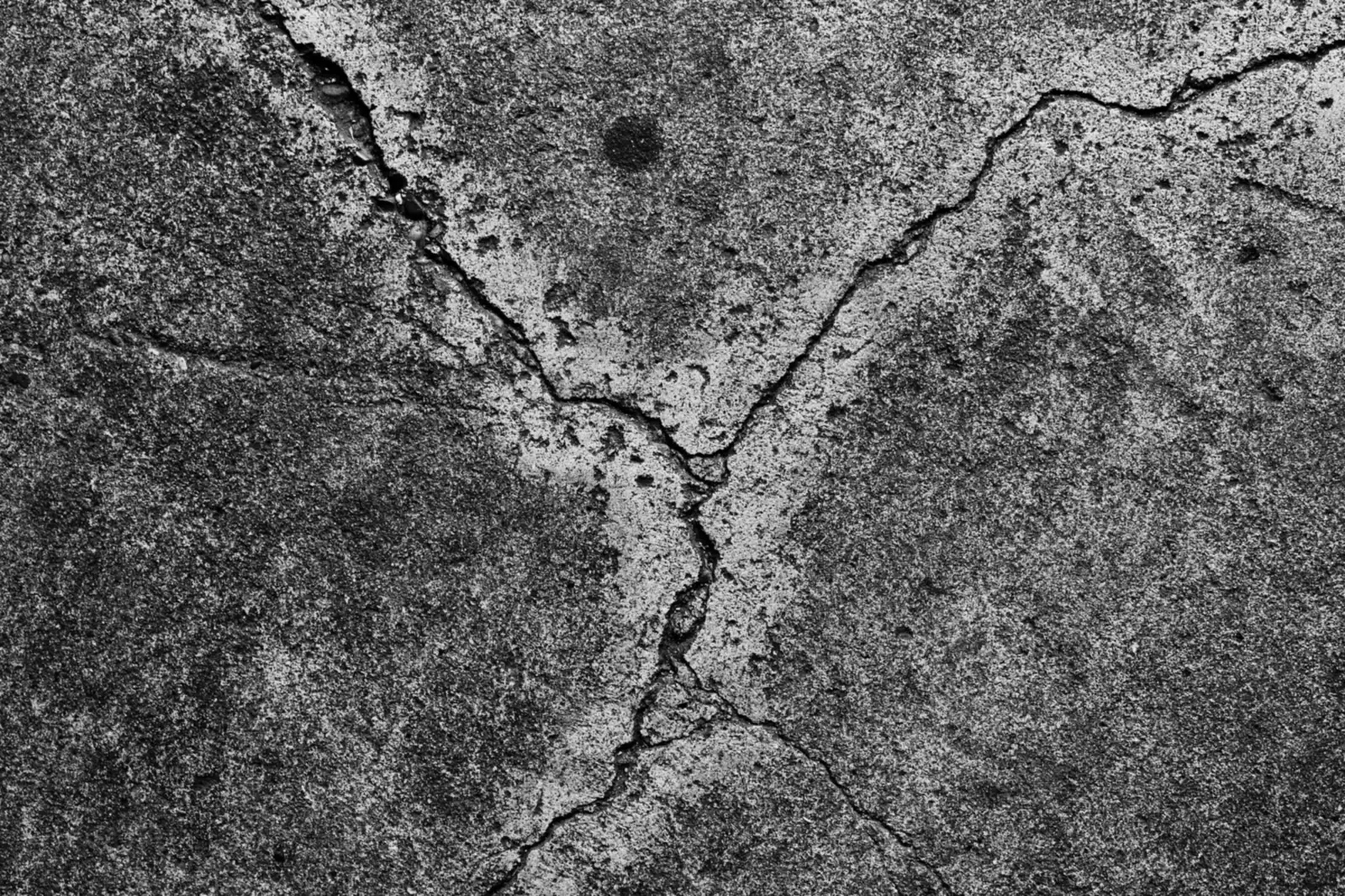 Cracked grey concrete surface